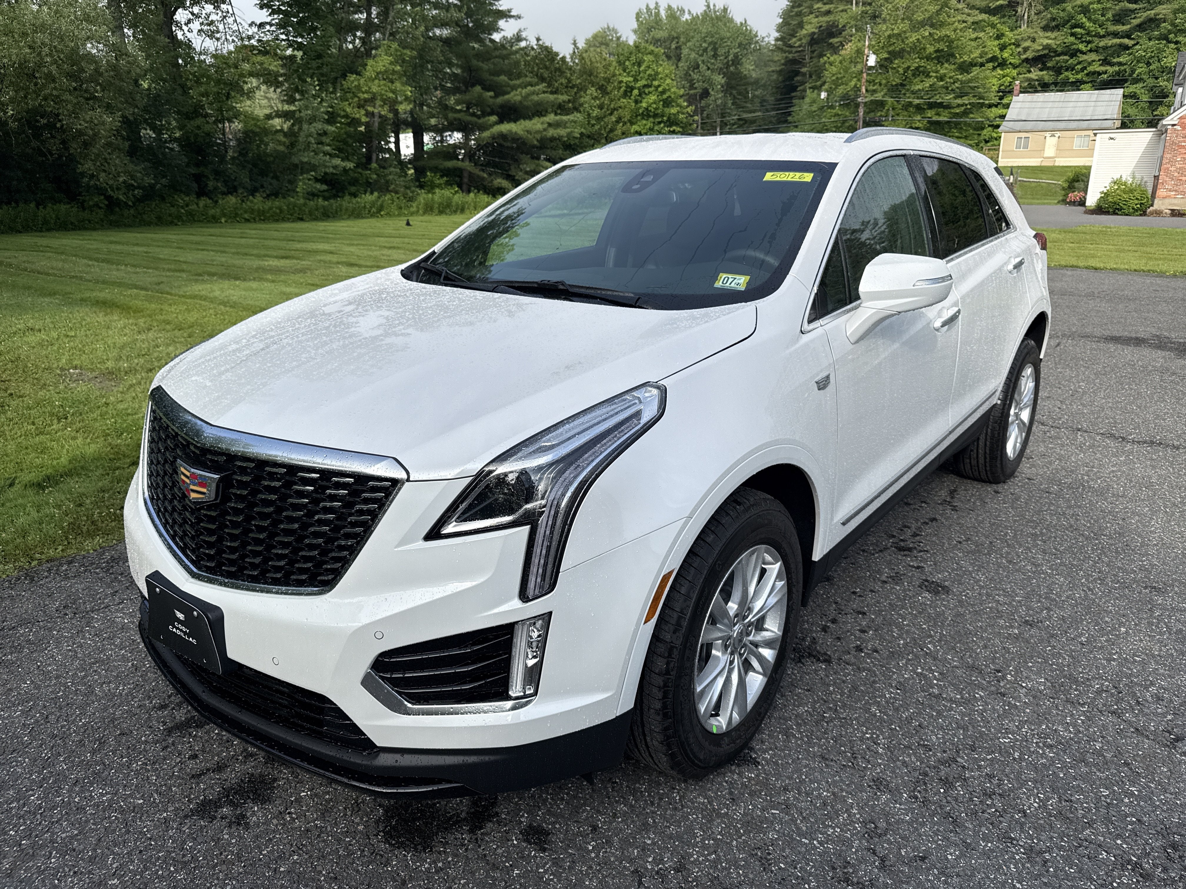 2026 Cadillac XT5 Luxury in Crystal White Tricoat — front three-quarter view