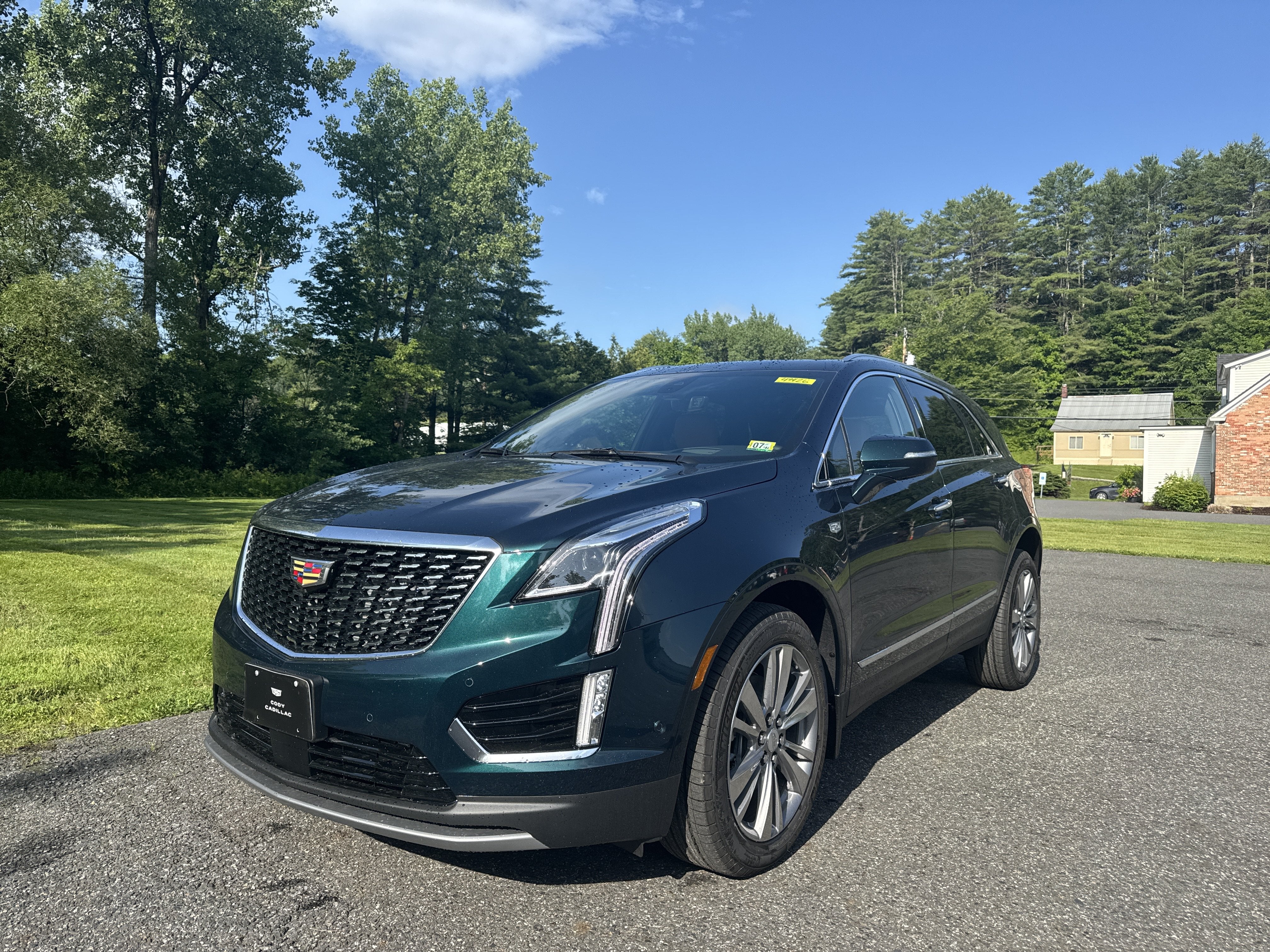 2026 Cadillac XT5 Premium Luxury in Emerald Lake Metallic — front three-quarter view