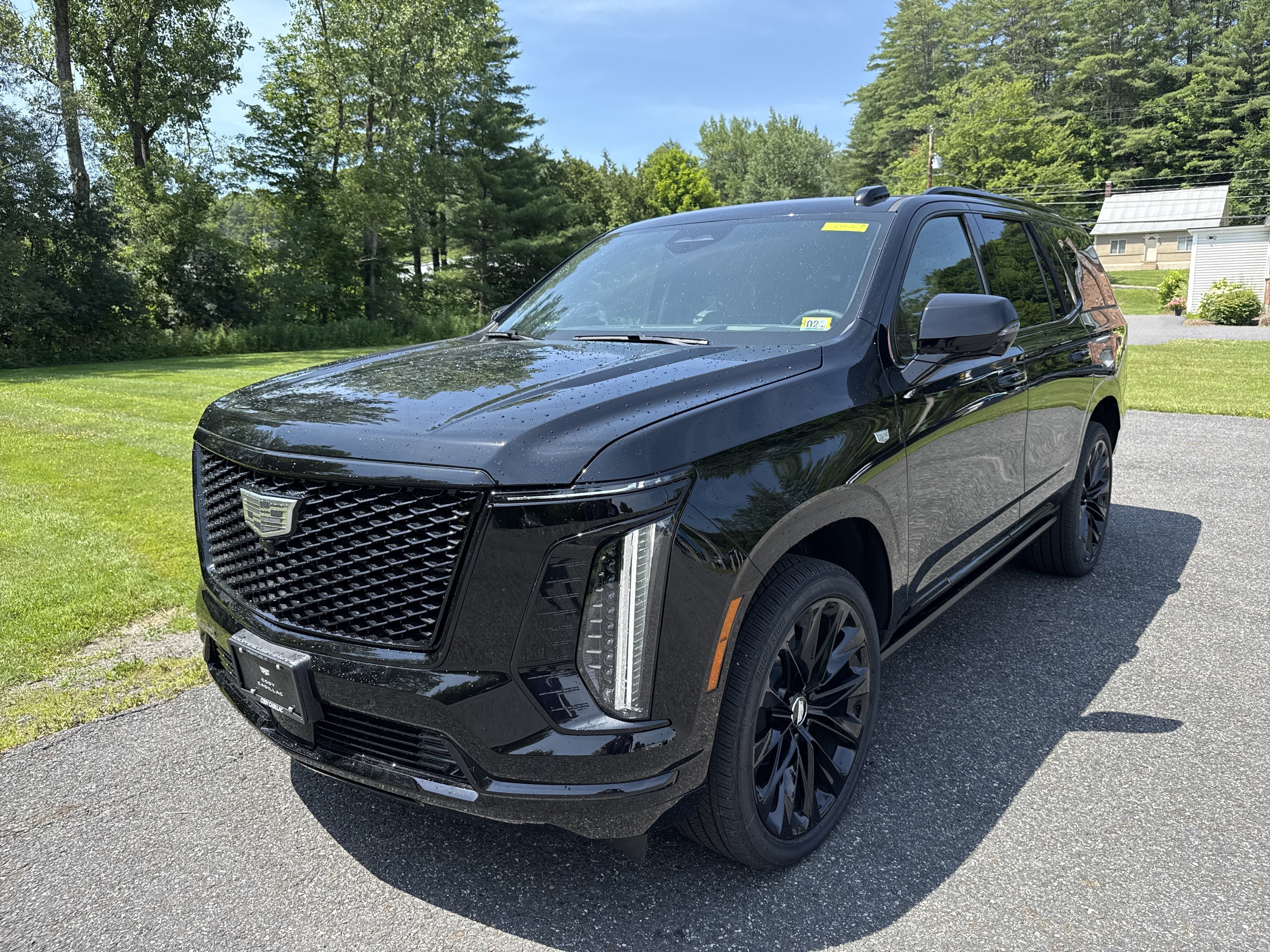 2026 Cadillac Escalade Platinum Sport in Black Raven — front three-quarter view